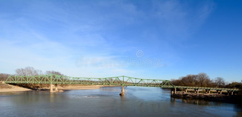 This is a late Fall picture of the St. Francisville Bridge over the Des Moines River that connects Lee County, Iowa and Clark County, Missouri. The bridge constructed in 1937 is an example of a Riveted Cantilever Through Truss Bridge, and is the last private toll bridge in Iowa. This picture was taken on November 14, 2015. This is a late Fall picture of the St. Francisville Bridge over the Des Moines River that connects Lee County, Iowa and Clark County, Missouri. The bridge constructed in 1937 is an example of a Riveted Cantilever Through Truss Bridge, and is the last private toll bridge in Iowa. This picture was taken on November 14, 2015.