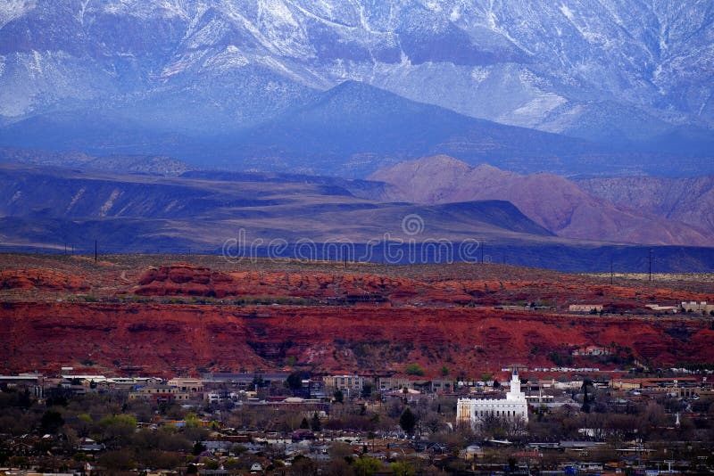 St. George Utah Valley with Mormon LDS Temple Red Cliffs and Snow Covered Mountains. View of St. George Utah valley with Mormon LDS Temple red rocks and snow