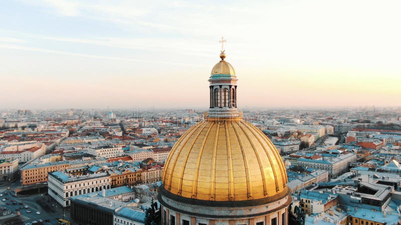 St. Isaac`s Cathedral in St. Petersburg at sunset, aerial view, a beautiful flight around the dome of the cathedral. stock image St. Isaac`s Cathedral in St. Petersburg at sunset, aerial view, a beautiful flight around the dome of the cathedral. stock image
