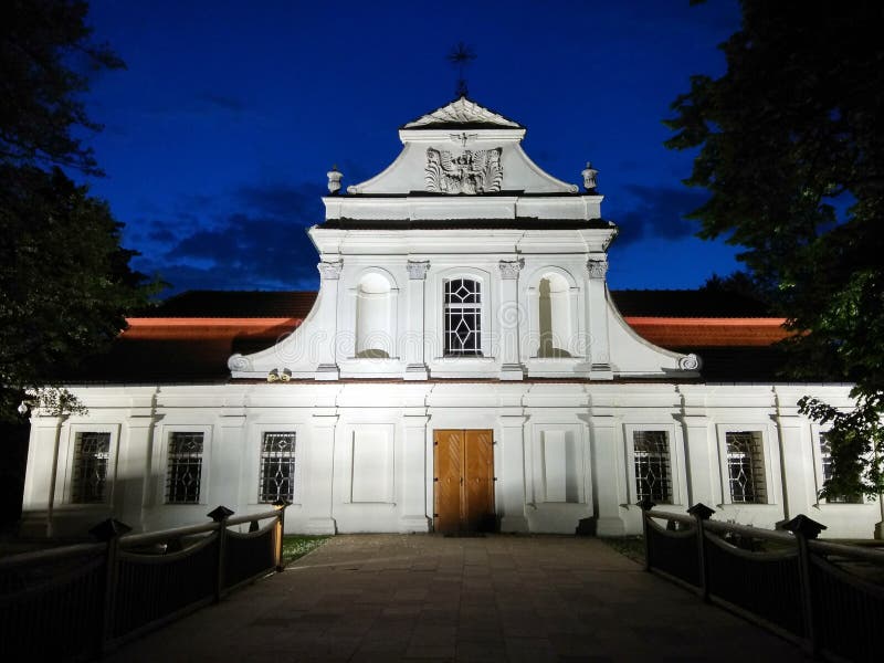 St.John`s of Nepomuk Church at night on a lake in Zwierzyniec, P