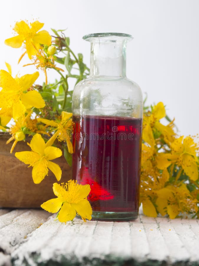 Fresh flowers with herbal oil in the bootle. Green herbal drug medicine stock images, royalty-free photos and pictures