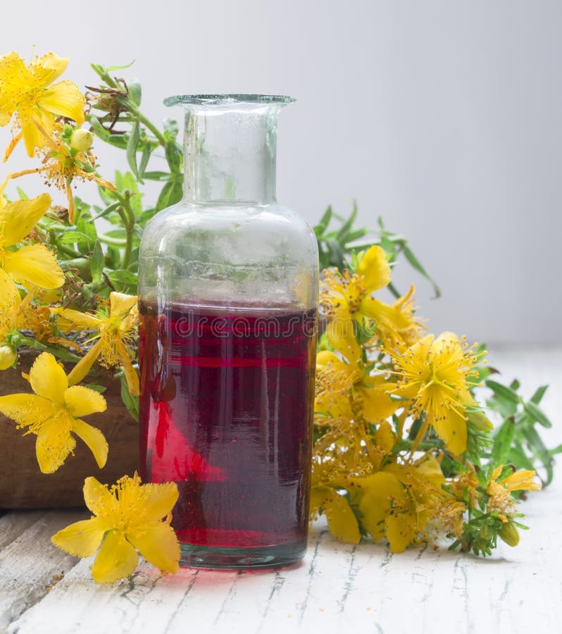 Fresh flowers with herbal oil in the bootle. Green herbal drug medicine stock images, royalty-free photos and pictures
