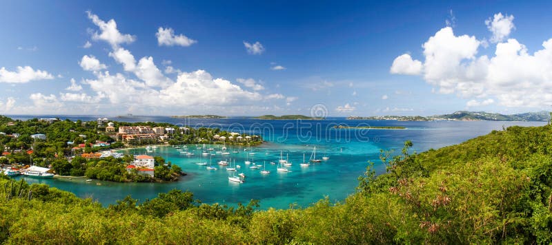 A wonderfully colorful view from above the fleet of sailboats and yachts anchored the harbor in Cruz Bay on the island of St. John, in the US Virgin Islands. St. John is a fantastic place to persue outdoor recreation activities such as sailing, hiking, swimming, snorkeling, scuba diving, kayaking and fishing. St. John is a popular day trip destination for cruise ship passengers visiting nearby St. Thomas. A wonderfully colorful view from above the fleet of sailboats and yachts anchored the harbor in Cruz Bay on the island of St. John, in the US Virgin Islands. St. John is a fantastic place to persue outdoor recreation activities such as sailing, hiking, swimming, snorkeling, scuba diving, kayaking and fishing. St. John is a popular day trip destination for cruise ship passengers visiting nearby St. Thomas.