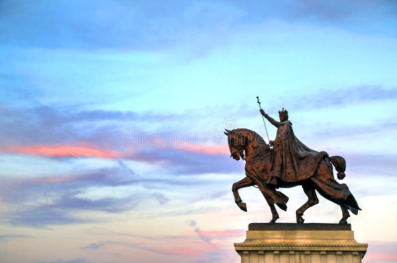 July 7, 2017 - St. Louis, Missouri - The sunset over the Apotheosis of St. Louis statue of King Louis IX of France, namesake of St. Louis, Missouri in Forest Park, St. Louis, Missouri. July 7, 2017 - St. Louis, Missouri - The sunset over the Apotheosis of St. Louis statue of King Louis IX of France, namesake of St. Louis, Missouri in Forest Park, St. Louis, Missouri.