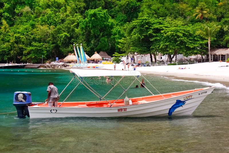 St. Lucia - de Taxi van het Water van het Strand van de Jaloezie royalty-vrije stock afbeelding St. Lucia - de Taxi van het Water van het Strand van de Jaloezie royalty-vrije stock afbeelding