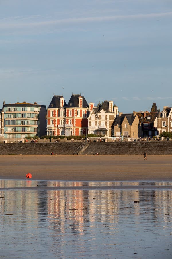 Beach in the Evening Sun and Buildings Along the Seafront Promenade in ...