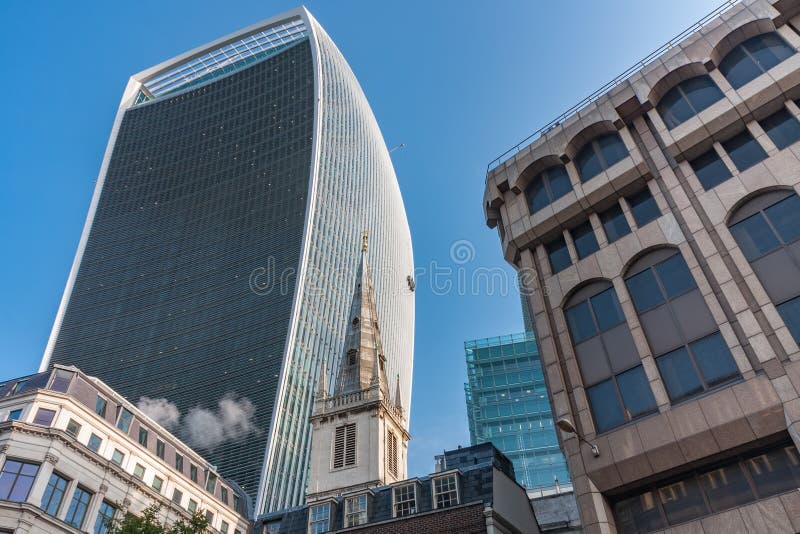St. Margaret Pattens, Church of England church in the city of London, on background skyscraper. St. Margaret Pattens, Church of England church in the city of London, on background skyscraper