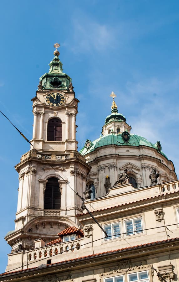 Prague, Czech Republic, March 22, 2019: St. Nicholas Cathedral, Prague Czech Republic dome and clock tower. Prague, Czech Republic, March 22, 2019: St. Nicholas Cathedral, Prague Czech Republic dome and clock tower