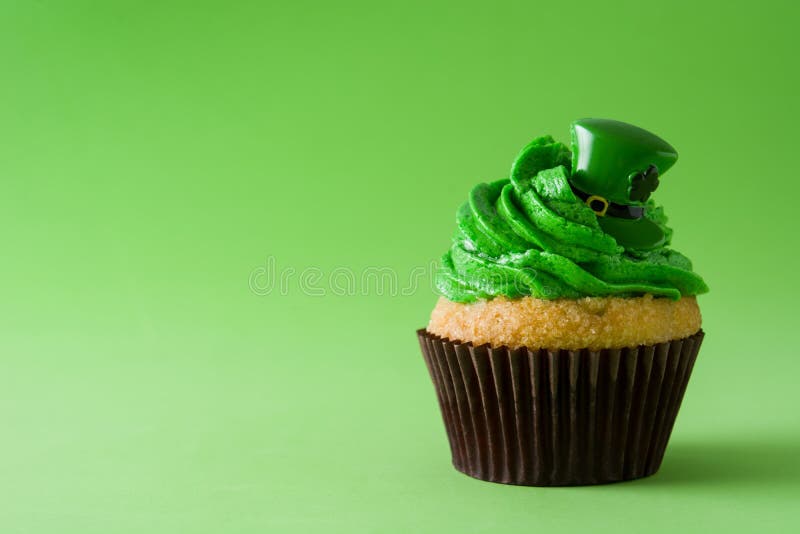 St. Patrick`s Day cupcake on green background. Copyspace. Day copyspace stock images, royalty-free photos and pictures