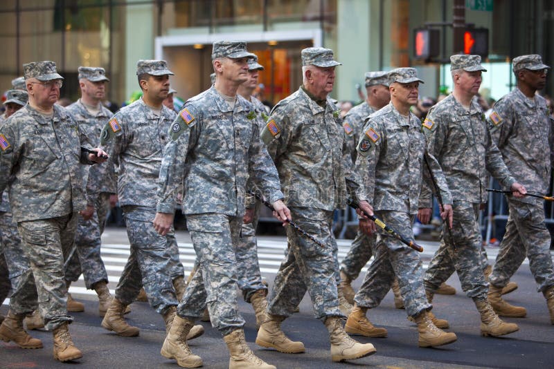NEW YORK, NY, USA MAR 17: Marching US miltary soldiers from the 69th Infantry at the St. Patrick's Day Parade on March 17, 2012 in New York City, United States. NEW YORK, NY, USA MAR 17: Marching US miltary soldiers from the 69th Infantry at the St. Patrick's Day Parade on March 17, 2012 in New York City, United States.