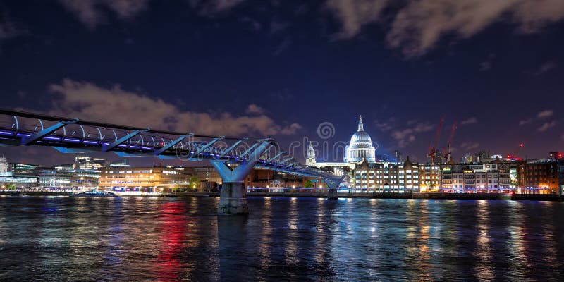 St Paul`s Cathedral and the Millennium Bridge at night royalty free stock photo St Paul`s Cathedral and the Millennium Bridge at night royalty free stock photo