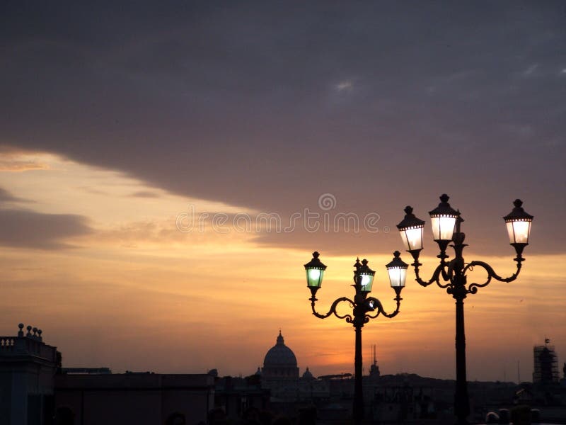 St peter's dome at sunset with street lamps royalty free stock photography St peter's dome at sunset with street lamps royalty free stock photography