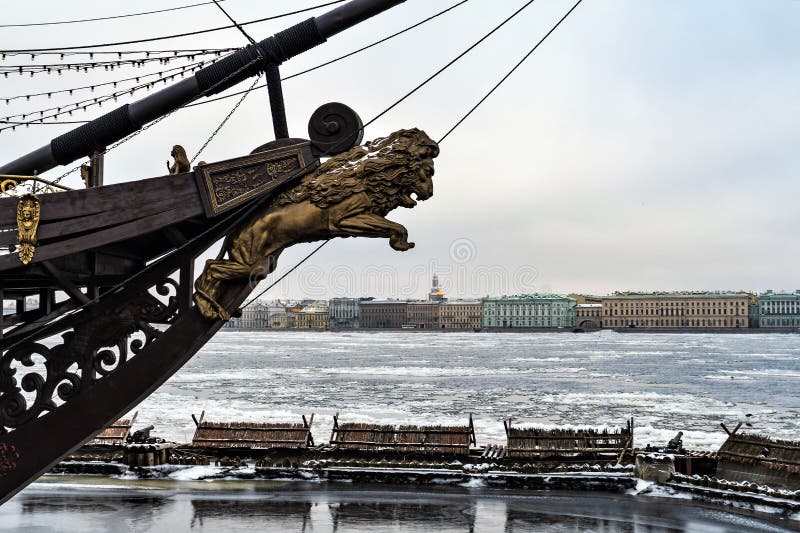 St. Petersburg, Russia, February 2020. Bouncing lion on the bow of a vintage ship against the backdrop of the city.