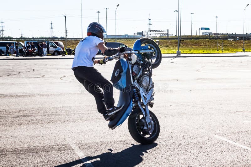 Free Photo  Moto rider making a stunt on his motorbike biker