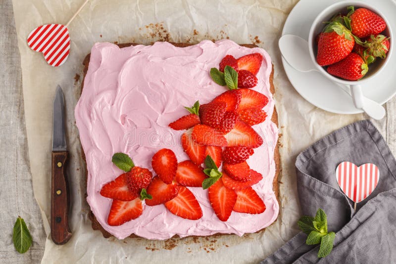 St.Valentine`s Day Cake for breakfast with pink glaze and fresh