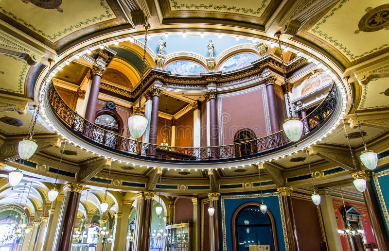 Inside the Des Moines Iowa State Capital building with ornate architecture and painted ceilings. Inside the Des Moines Iowa State Capital building with ornate architecture and painted ceilings