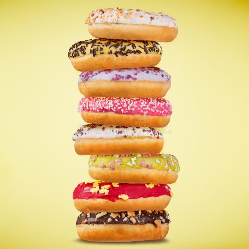 Stack of Assorted Donuts on Pastel Background. Stock Photo - Image of ...