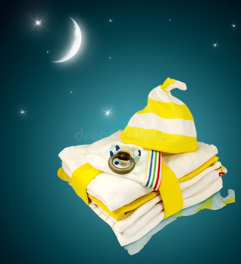 Stack Baby Infant Newborn Clothes Background. Stock Image - Image of