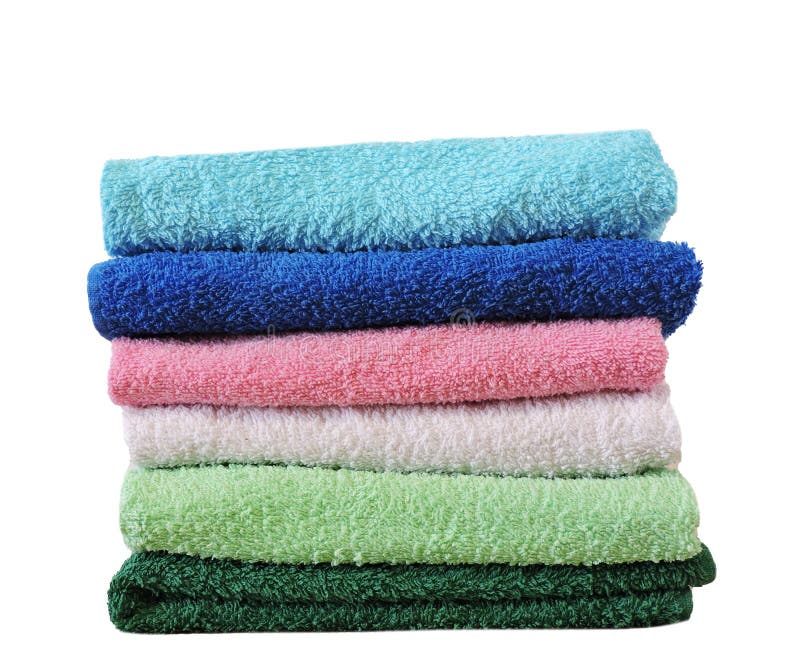 Stack of Bath Towels on Light Wooden Background Closeup.Pile of Rainbow