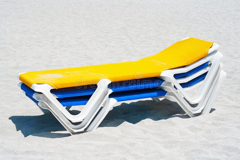 A Stack of Beach Chairs in the Sand Stock Photo Image of group