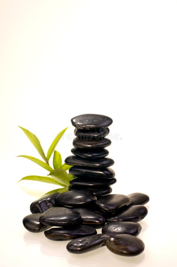 Stack of Black Zen Stones with a Bamboo Plant Stock Image Image of