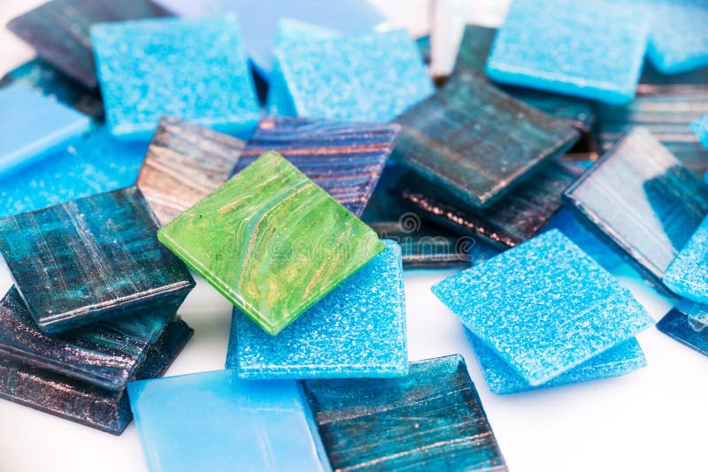 Stack of blue and green glass mosaic tiles