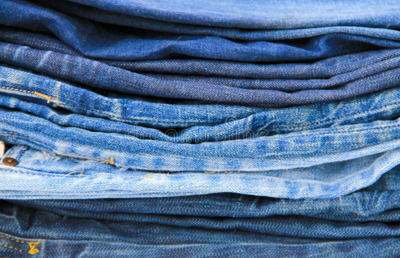 Stack of blue jeans close-up royalty free stock image
