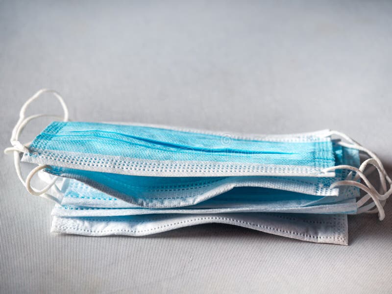 A Stack of Blue Protective Masks Used for Medical Purposes Stock Photo