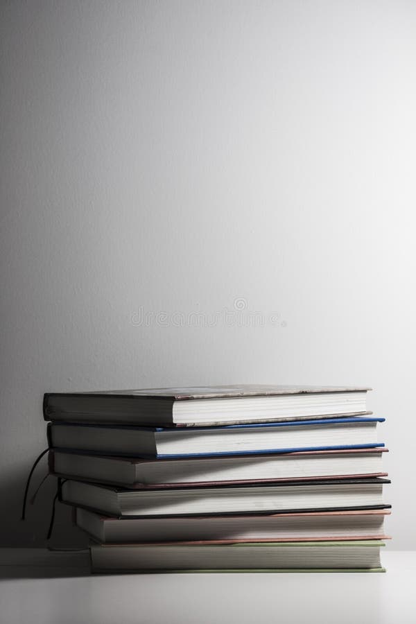 Stack of Book on a White Desk Stock Photo - Image of literature, text ...