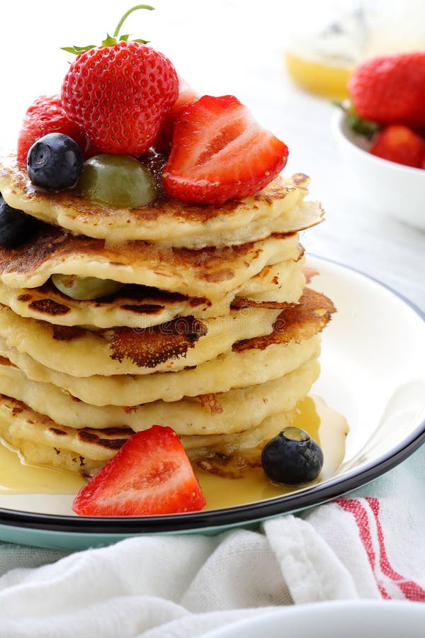 Stack of Breakfast Pancakes with Fruits and Sauce Stock Photo Image