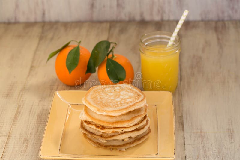 Breakfast Buttermilk Pancakes with Syrup and Fresh Orange Juice Stock