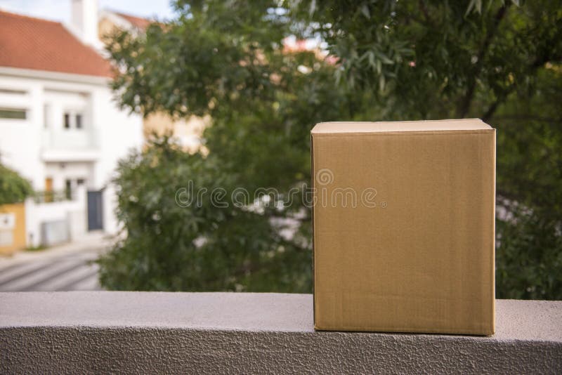 Cardboard Moving Box on Garden Stock Photo - Image of packer, gift