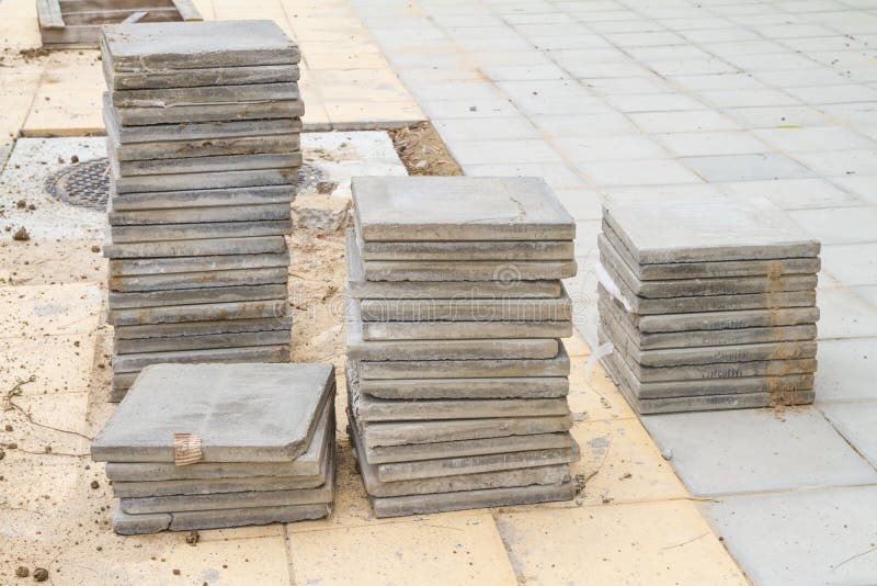 Stack of Cement Floor Tiles at Road Side Construction Site Stock Image