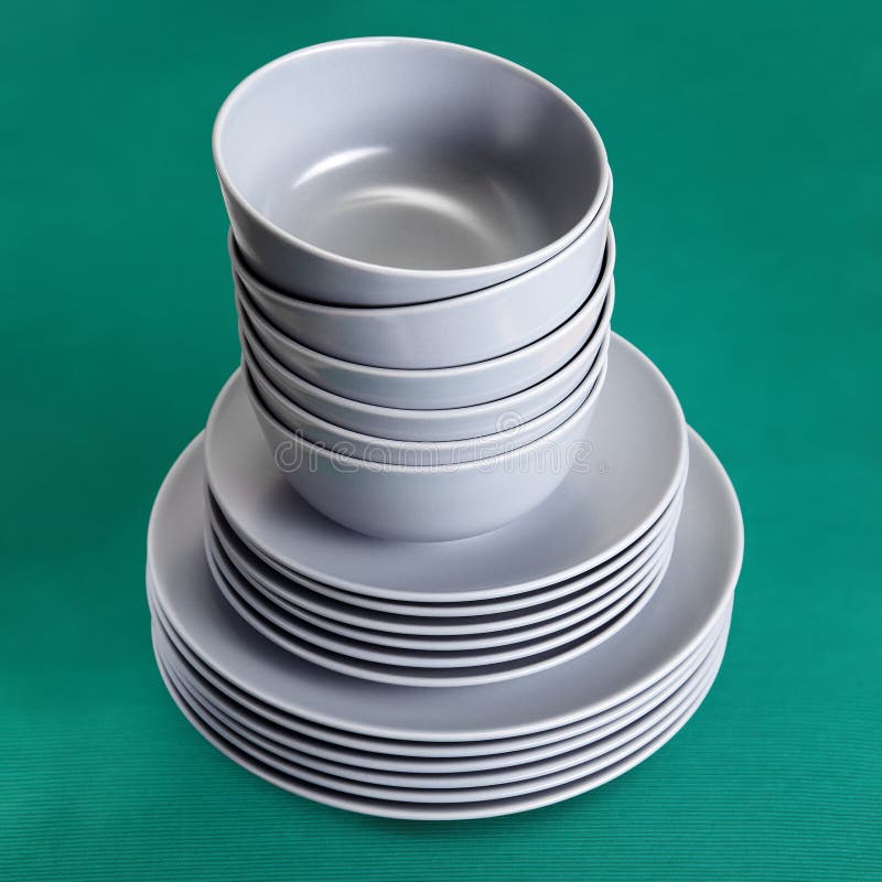 A Stack Of Ceramic Kitchen Utensils In Gray Glaze Stock Photo Image