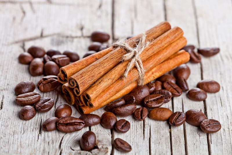 Stack of cinnamon sticks and coffee beans
