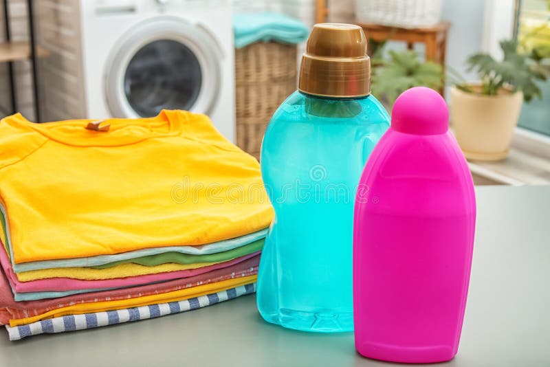 Stack of Clean Clothes and Bottles with Detergents Stock Photo Image
