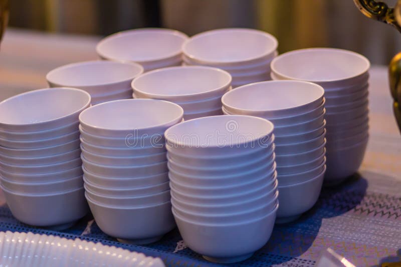 Stack of Clean White Bowl on a Table for a Buffet in the Restaurant