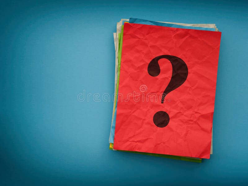 A stack of colorful paper notes with a question mark on them on a blue background stock images