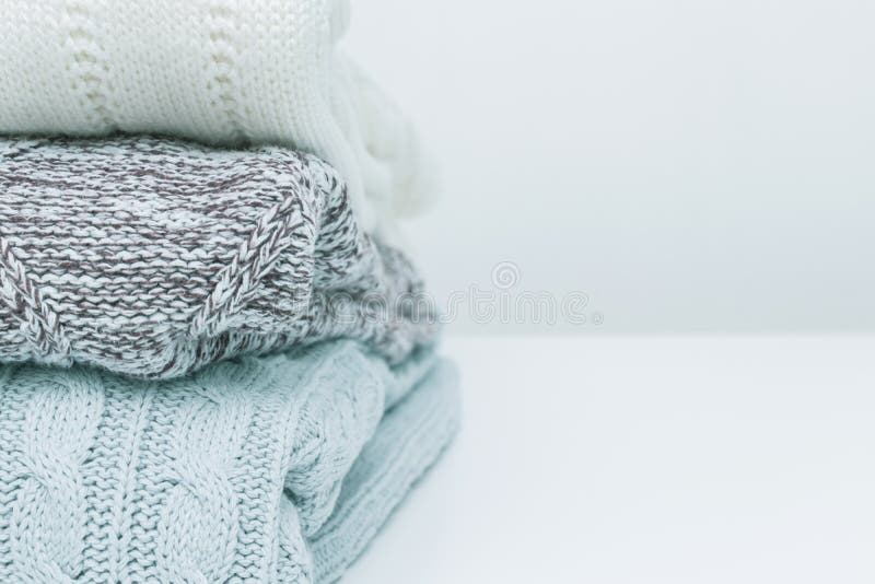 Stack of Cozy Comfortable Homely Clean Washed Knitted Pullovers in