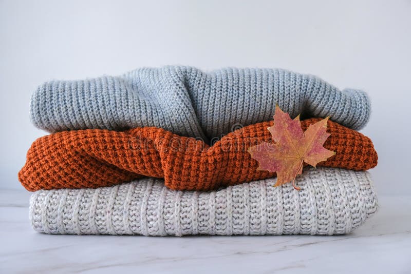 Stack of Cozy Knitted Warm Sweater with Autumn Fall Maple Leaf ...