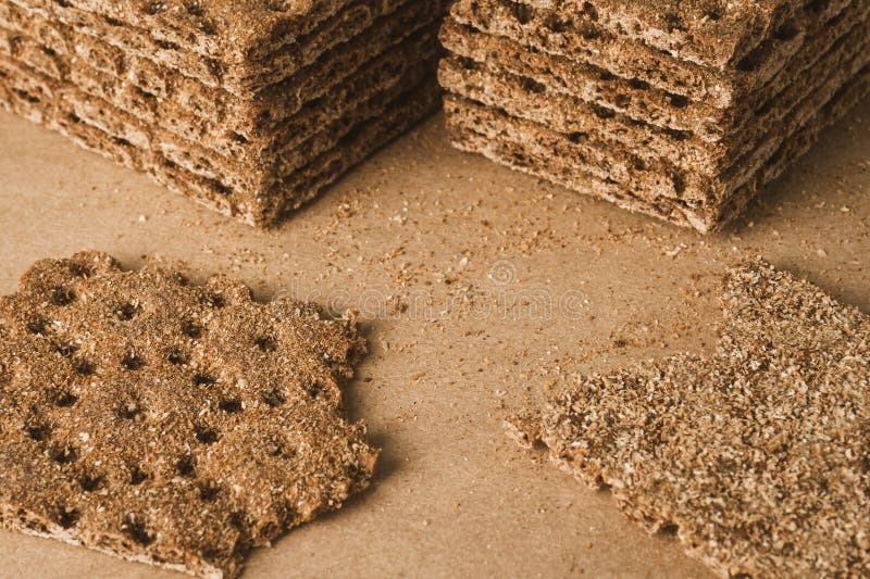 Stack of Crispy Wheat, Rye and Corn Flatbread Crackers. Healthy Food Background. High Angle View