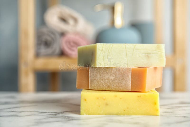 Stack of different handmade soap bars on table royalty free stock photos