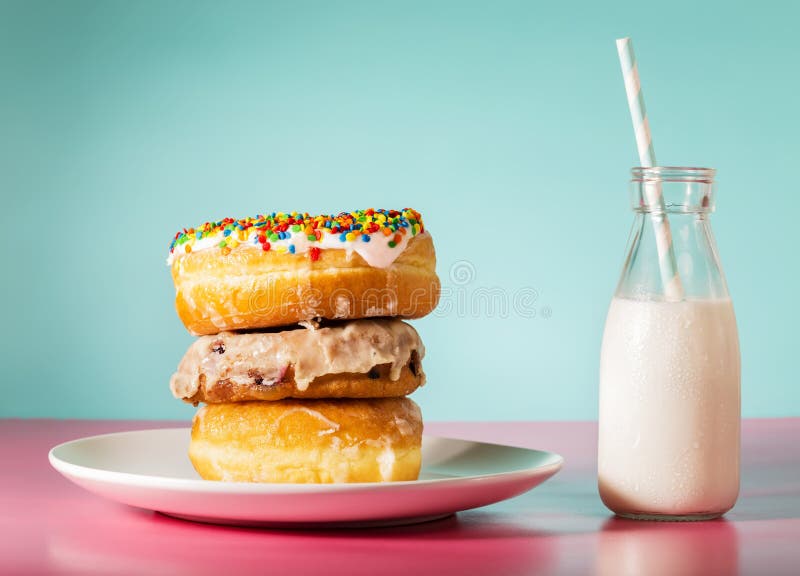 Stack of donuts with milk in a jar royalty free stock photos Stack of donuts with milk in a jar royalty free stock photos