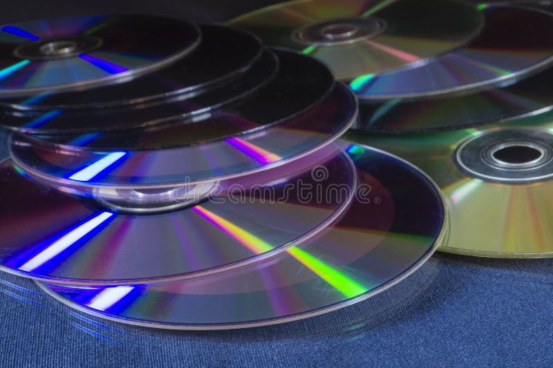 A stack of DVDs on a table with a reflection royalty free stock image