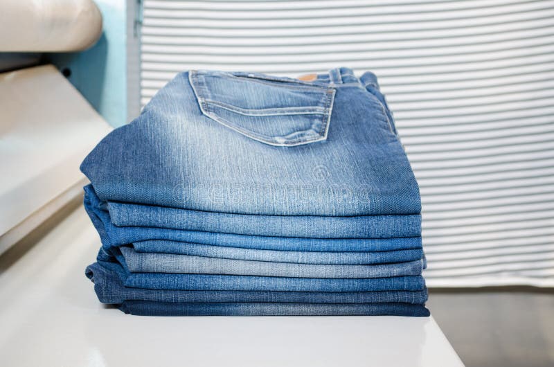 Stack of Folded Blue Denim Jeans on a Laundry Stock Image Image of