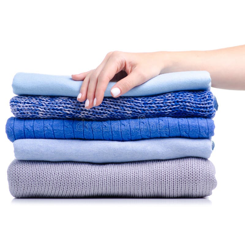 Stack folded blue shirt clothing hand holding stock images