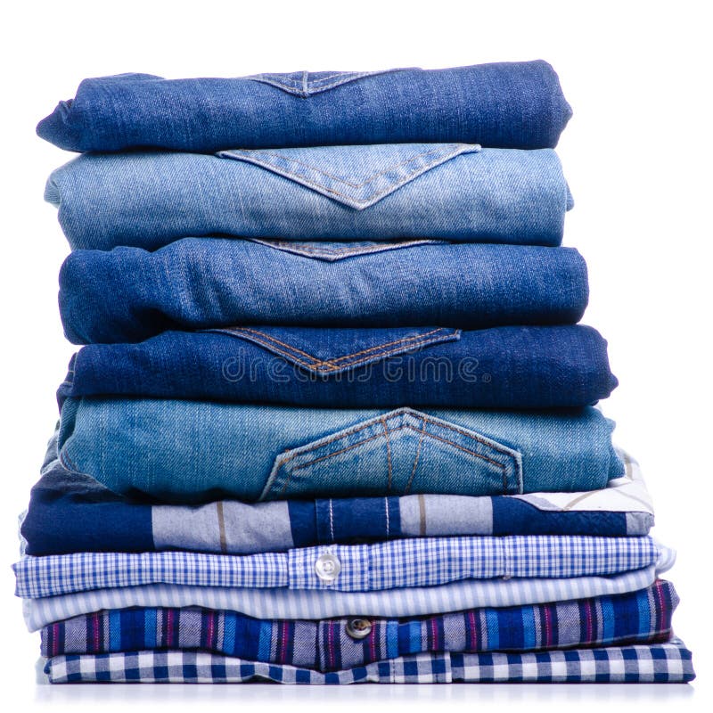 Stack folded casual shirt and jeans stock images