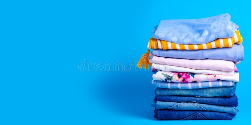 Stack folded colorful clothing summer, jeans royalty free stock photo
