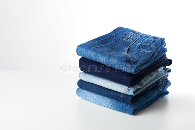 Stack of folded jeans stock image. Image of clothing - 222762707