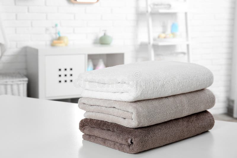 Stack of Fresh Towels on Table in Bathroom Stock Image Image of light